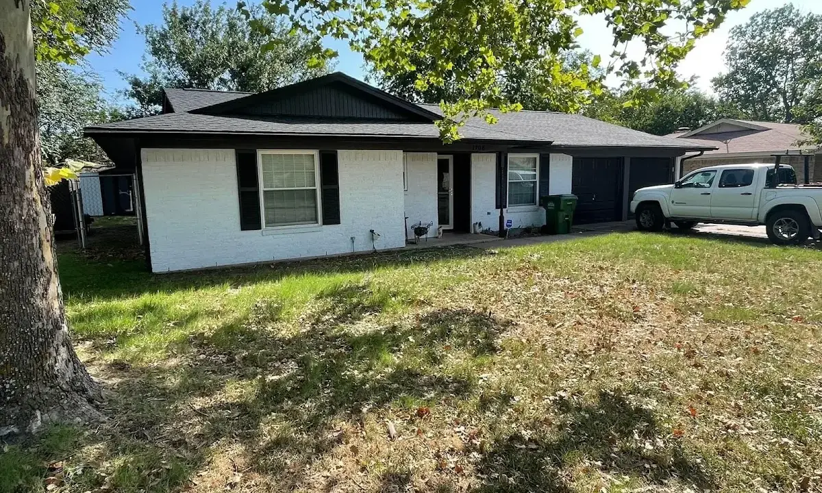 Professional roofing crew working on a residential roof in Wisconsin Rapids